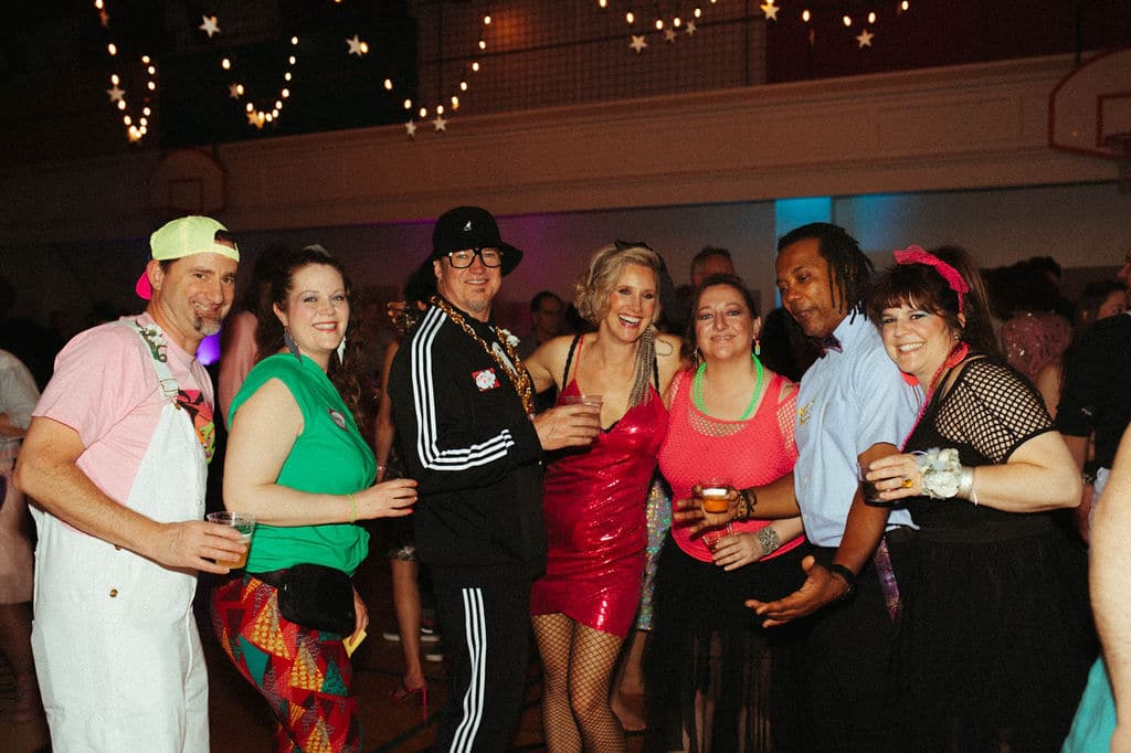 A group of friends at a party dancing